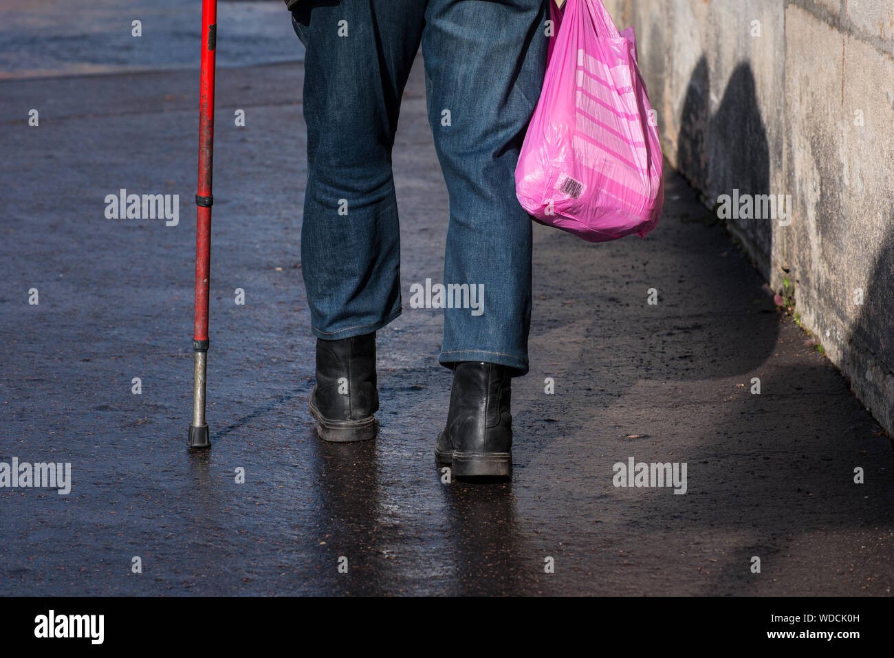Man walking with bag hi-res stock photography and images - Alamy