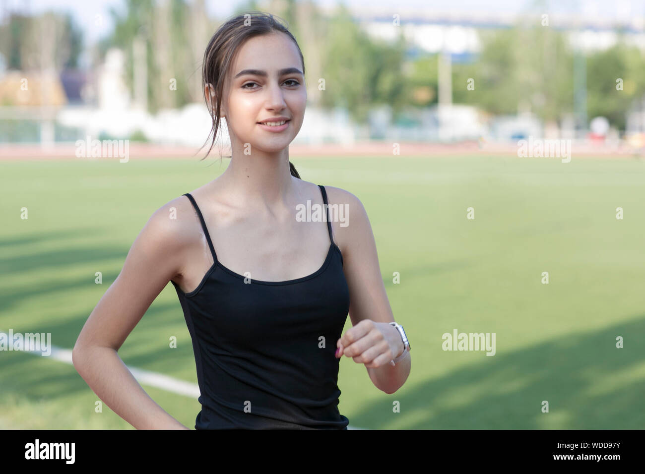 Woman athlete on a morning run in the stadium. Active lifestyle Stock Photo