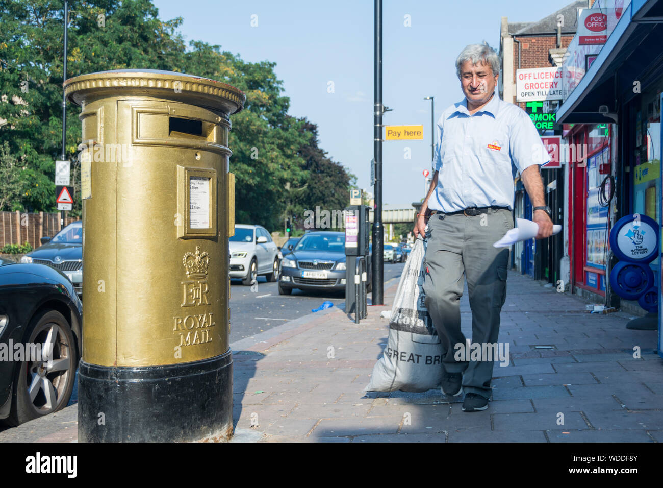 A gold post box in Isleworth to commemorate Mo Farah's Gold Medals in the London 2012 Olympics. Stock Photo