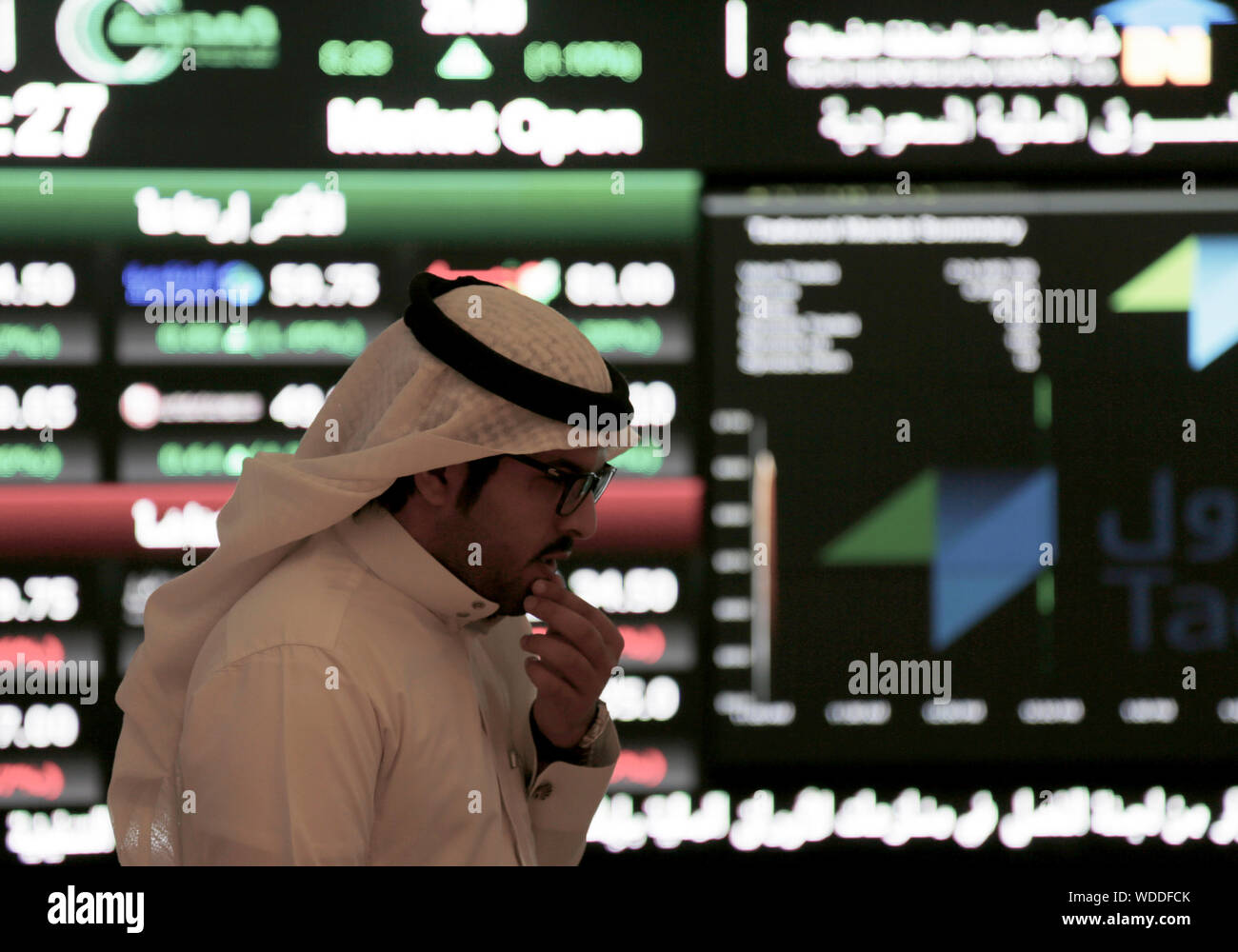 A Saudi Man Walks At The Tadawul Saudi Stock Exchange In Riyadh