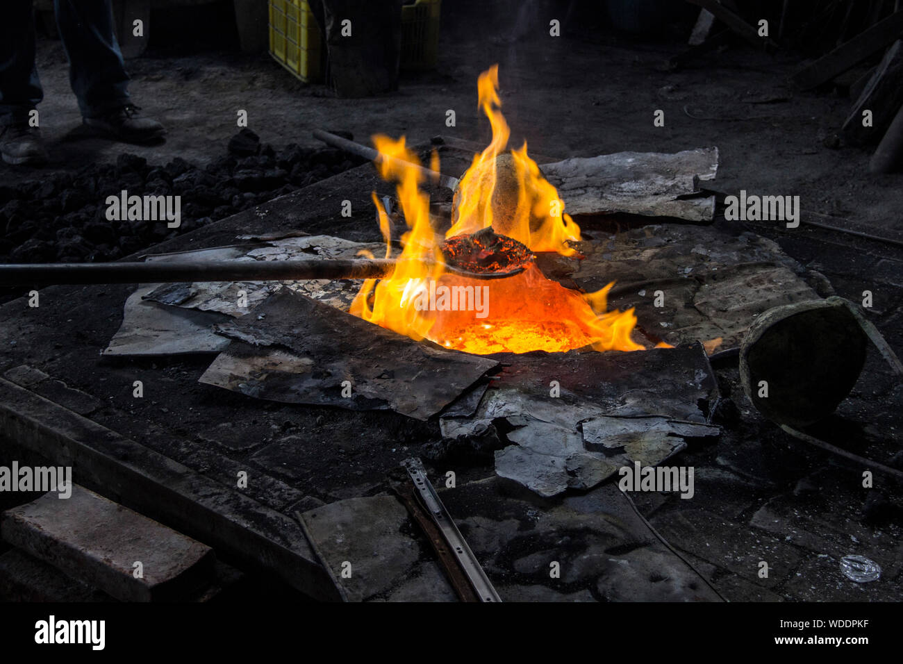 Iron Rod In Burning Fire Stock Photo