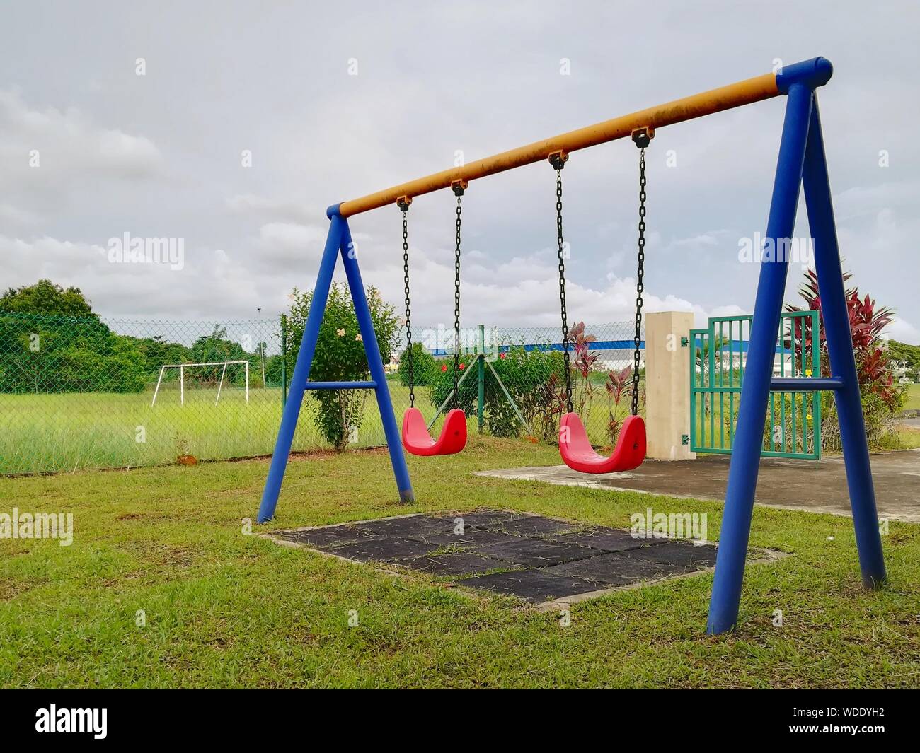 Swings in public park hires stock photography and images Alamy