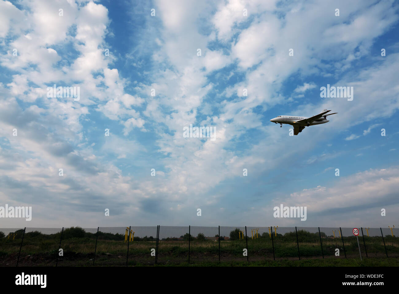 A small jet coming in to land at Liverpool John Lennon airport Stock Photo