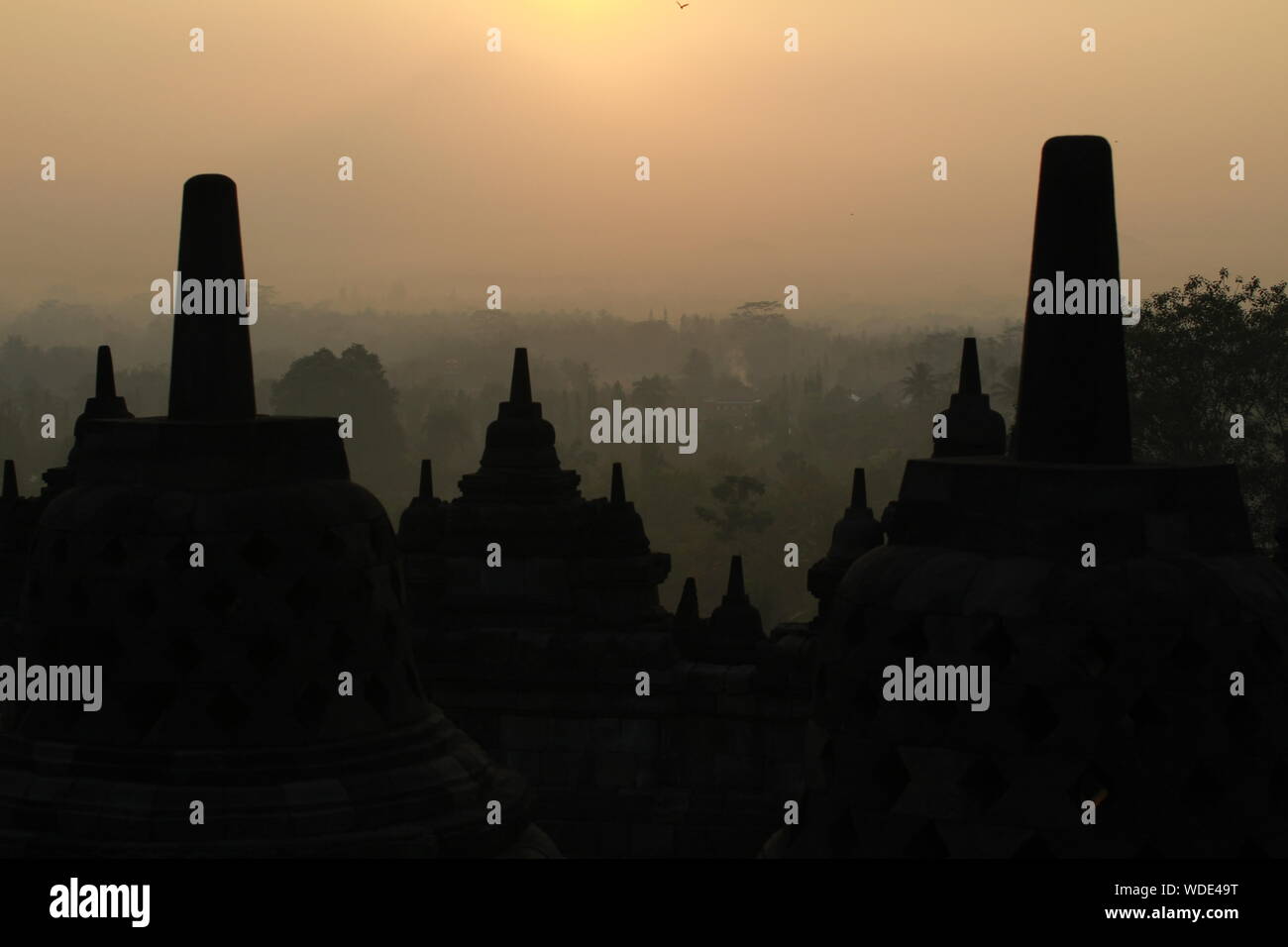 Silhouette Of Temple Building At Sunrise Stock Photo