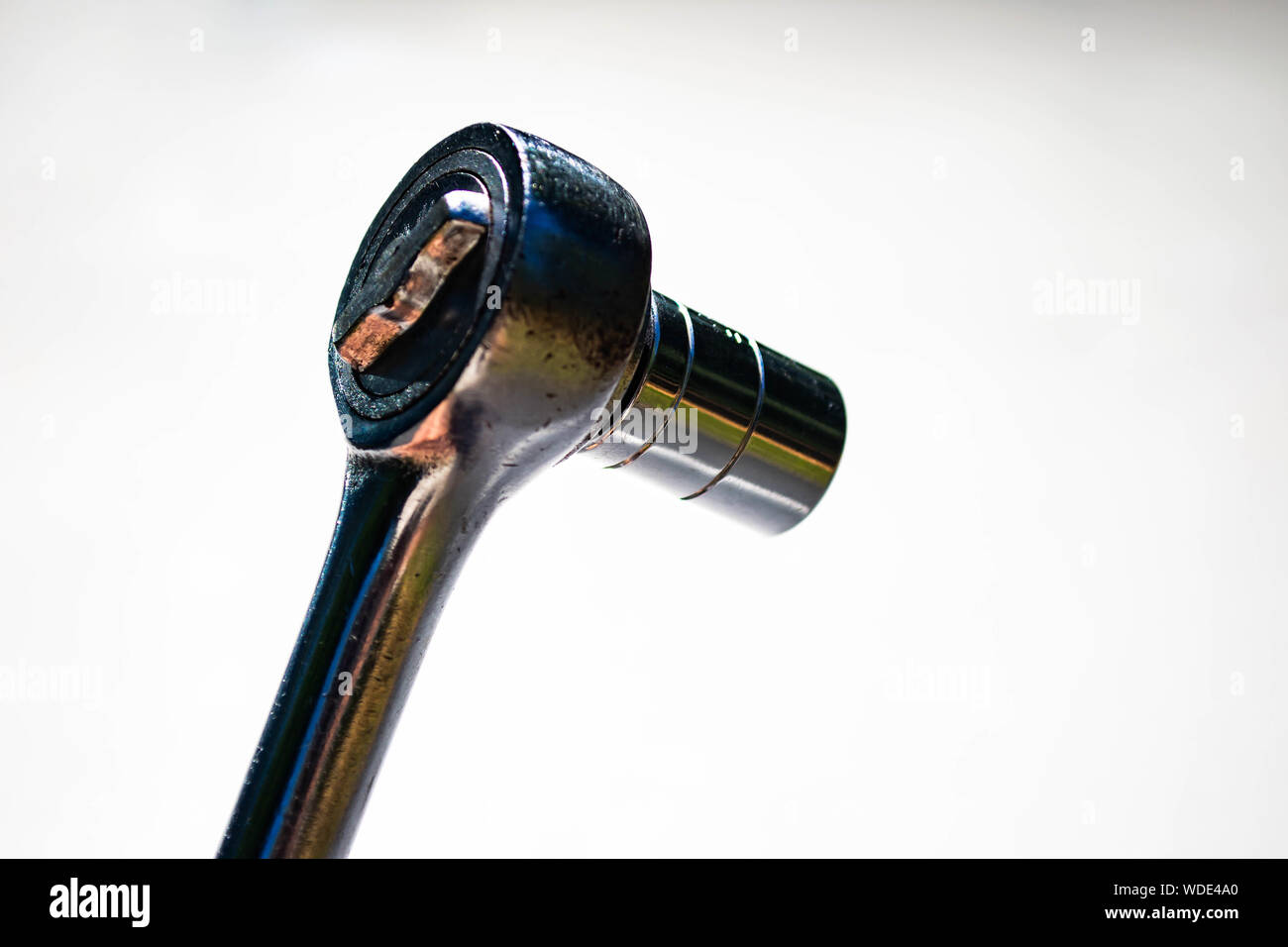 a chrome socket wrench on white background Stock Photo