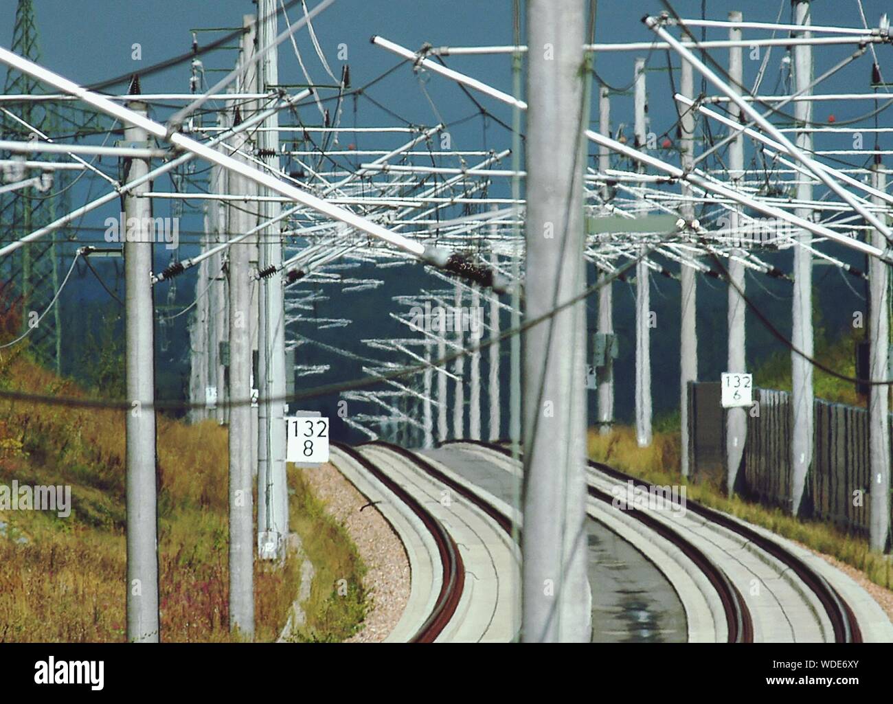 Railroad Tracks By Electricity Pylon Stock Photo Alamy