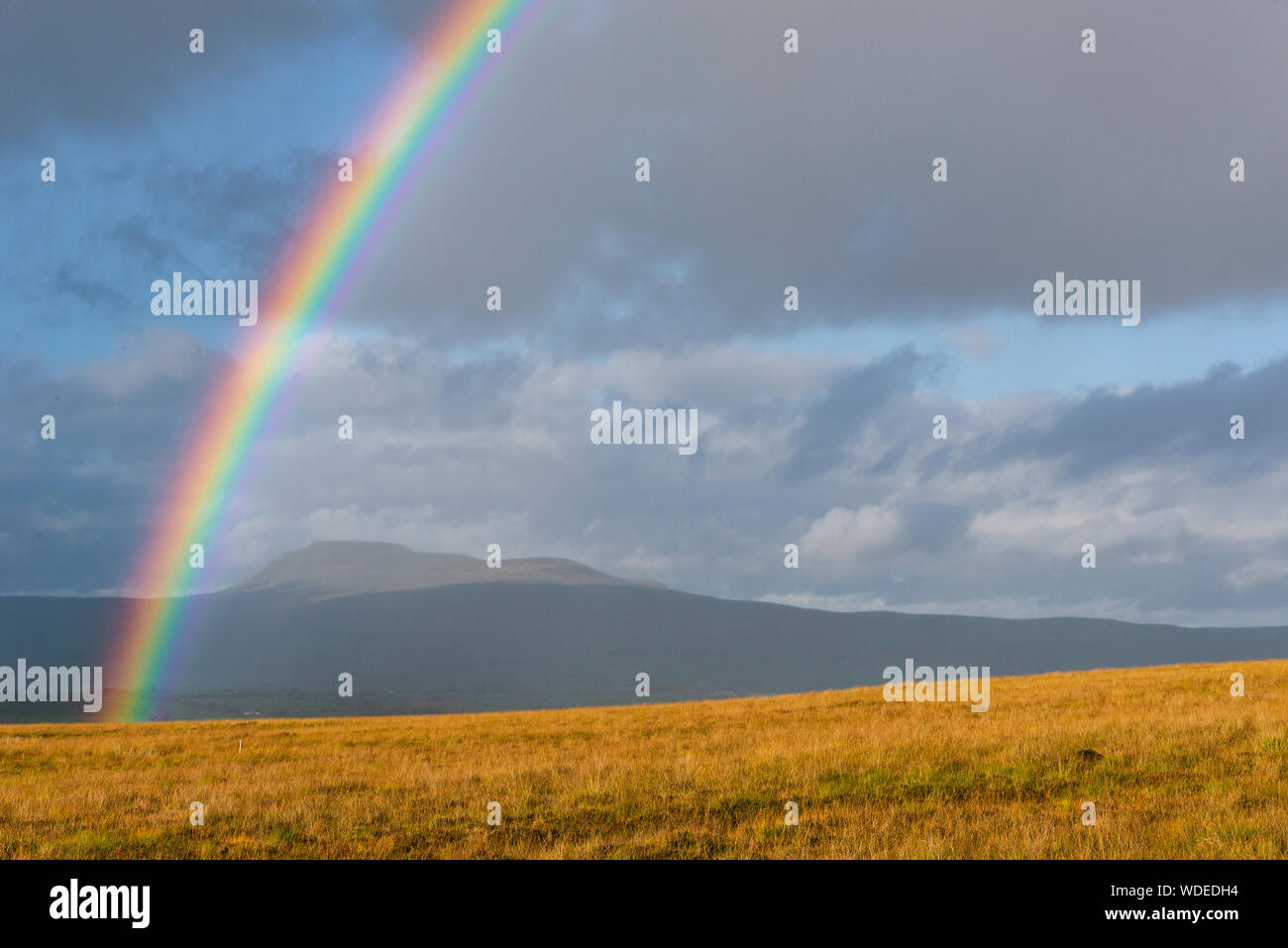 Rainbow over Bentham moor Yorkshire. Stock Photo