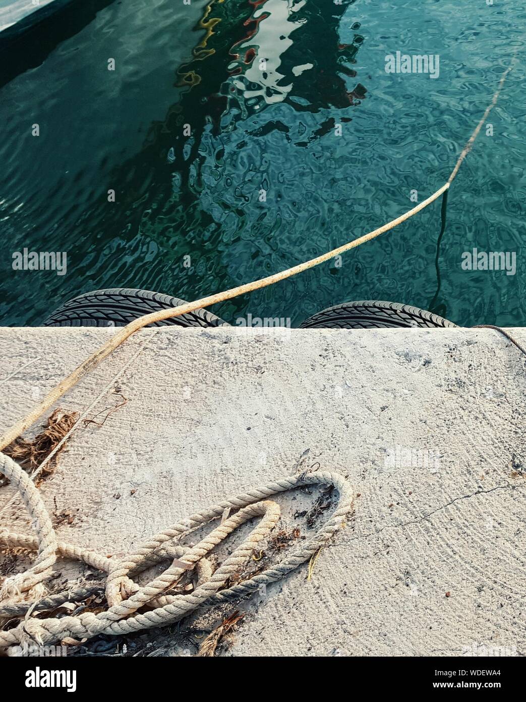 View Of Ropes On Jetty By Water Stock Photo - Alamy