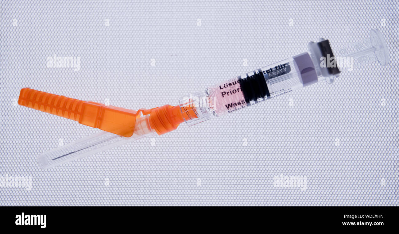 Hanover, Germany. 28th Aug, 2019. A syringe containing the vaccine Priorix (live virus vaccine against measles, mumps and rubella) is available in a paediatric practice. The federal cabinet has passed a law for compulsory measles vaccination. From March 2020, parents must prove that their children have been vaccinated before being admitted to a nursery or school. The compulsory vaccination also applies to certain adults, Credit: Julian Stratenschulte/dpa/Alamy Live News Stock Photo