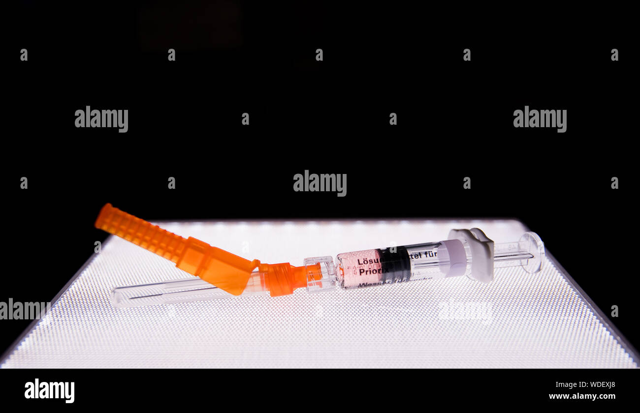 Hanover, Germany. 28th Aug, 2019. A syringe containing the vaccine Priorix (live virus vaccine against measles, mumps and rubella) is available in a paediatric practice. The federal cabinet has passed a law for compulsory measles vaccination. From March 2020, parents must prove that their children have been vaccinated before being admitted to a nursery or school. The compulsory vaccination also applies to certain adults, Credit: Julian Stratenschulte/dpa/Alamy Live News Stock Photo