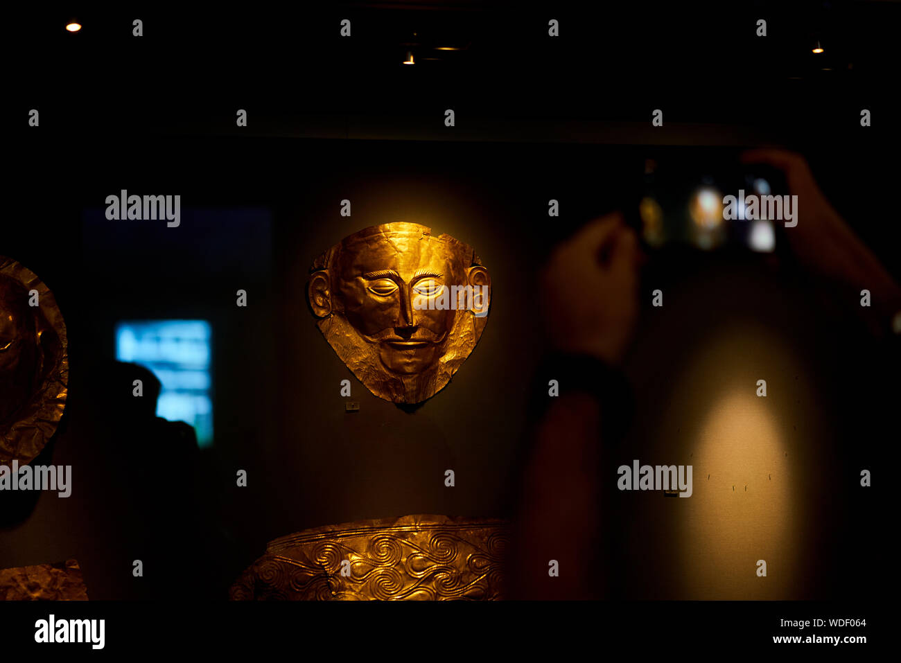 The so-called Mask of Agamemnon found at Mycenae, on display at the National Archaeological Museum in Athens, Greece Stock Photo