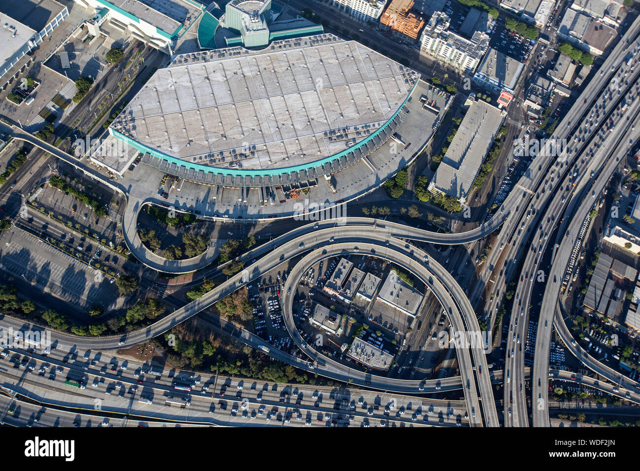 Los Angeles, California, USA - August 7, 2017:  Aerial view of LA Convention Center loading docks and busy freeways in downtown Los Angeles. Stock Photo