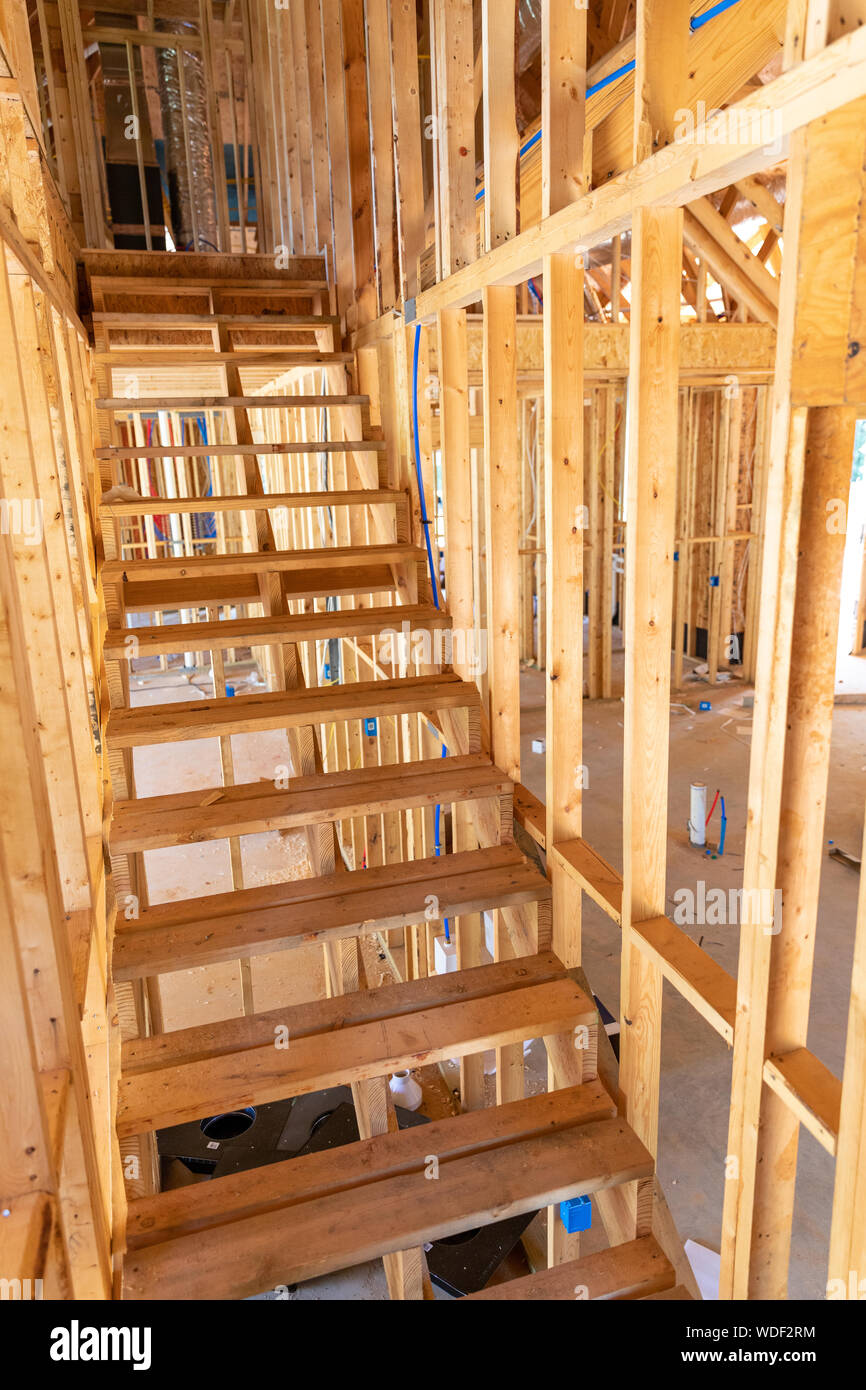 wood staircase and studs in new home construction Stock Photo Alamy