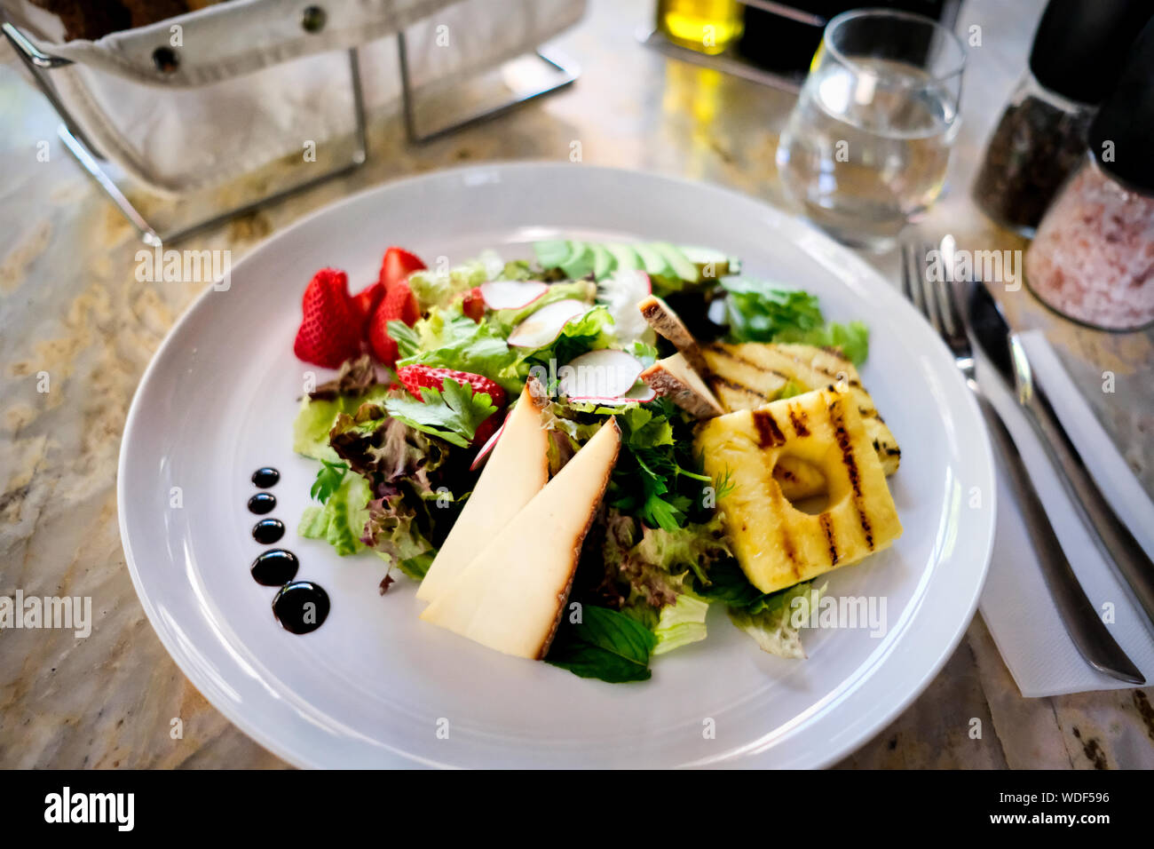 Cheese salad on a marble table. Organic salad. Stock Photo