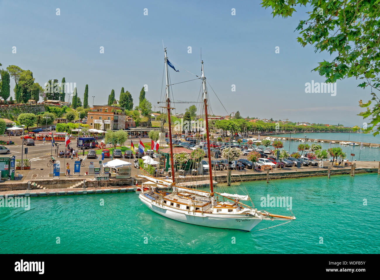 Quayside and the River Mincio flowing from Lake Garda at Peschiera del Garda, Veneto, Italy. Stock Photo