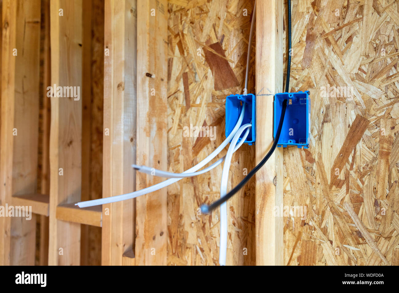 Electrical wiring and CATV cable in walls of new home construction Stock Photo