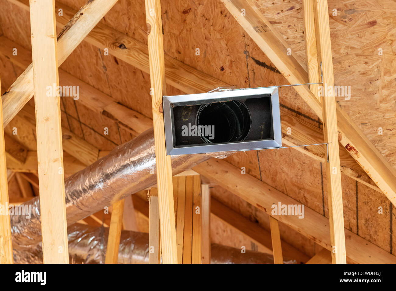 New air conditioner vents in new home construction Stock Photo