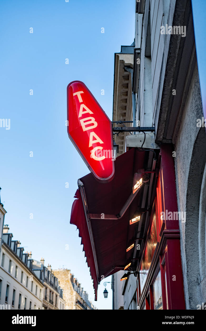 French Red And White Tabac Sign With Loto Logo Above Tabacconist Store ...