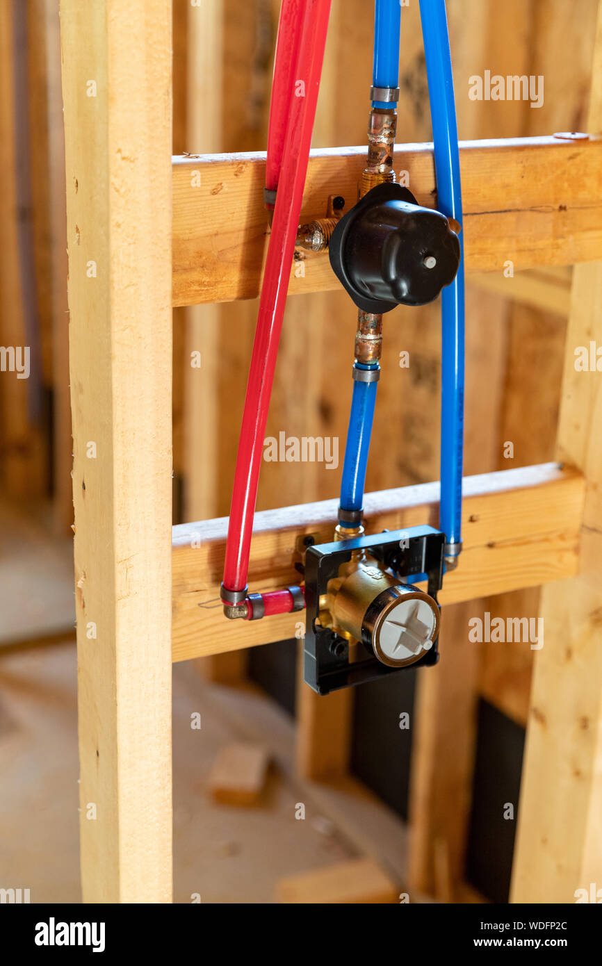 Shower faucet and water pipes in new home construction Stock Photo Alamy