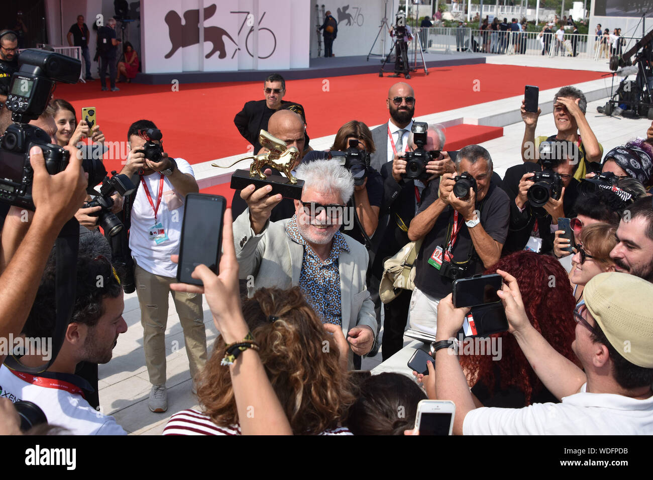 VENICE, Italy. 29th Aug, 2019. Pedro Almodovar shows the Golden Lion at Palazzo del Cinema after receiving it for lifetime achievements during the 76th Venice Film Festival on August 29, 2019 in Venice, Italy. Credit: Andrea Merola/Awakening/Alamy Live News Stock Photo