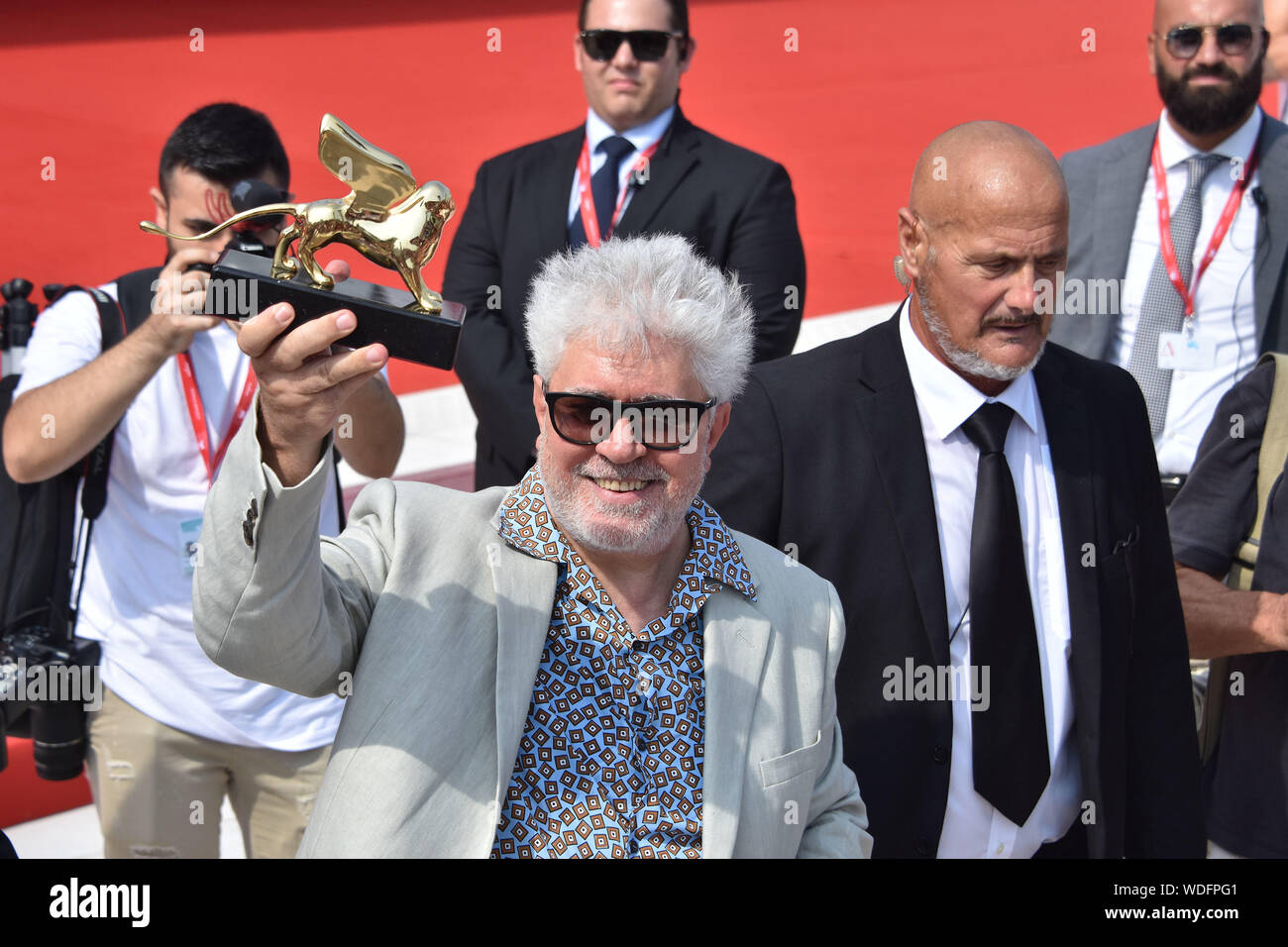 VENICE, Italy. 29th Aug, 2019. Pedro Almodovar shows the Golden Lion at Palazzo del Cinema after receiving it for lifetime achievements during the 76th Venice Film Festival on August 29, 2019 in Venice, Italy. Credit: Andrea Merola/Awakening/Alamy Live News Stock Photo