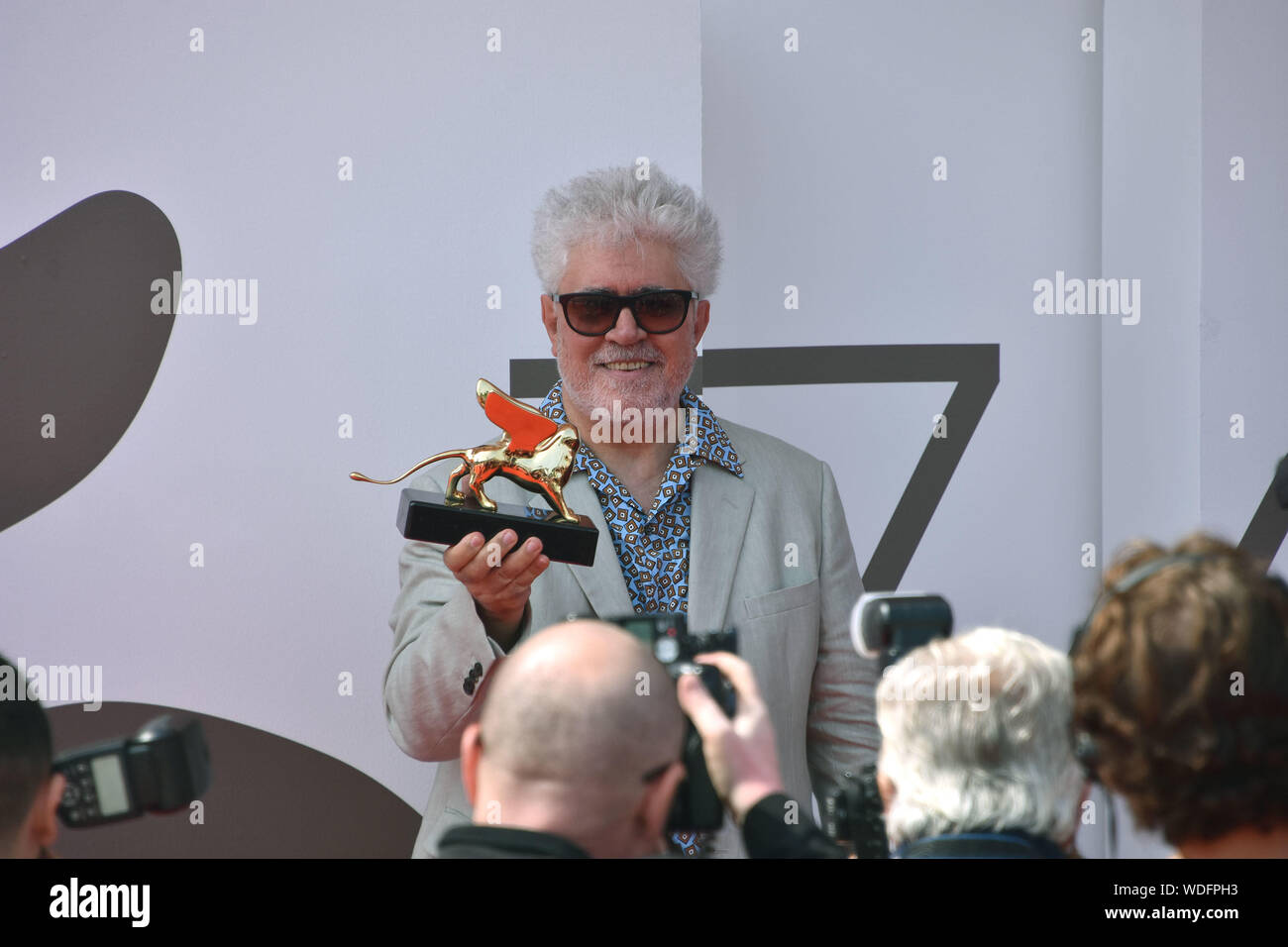 VENICE, Italy. 29th Aug, 2019. Pedro Almodovar shows the Golden Lion at Palazzo del Cinema after receiving it for lifetime achievements during the 76th Venice Film Festival on August 29, 2019 in Venice, Italy. Credit: Andrea Merola/Awakening/Alamy Live News Stock Photo