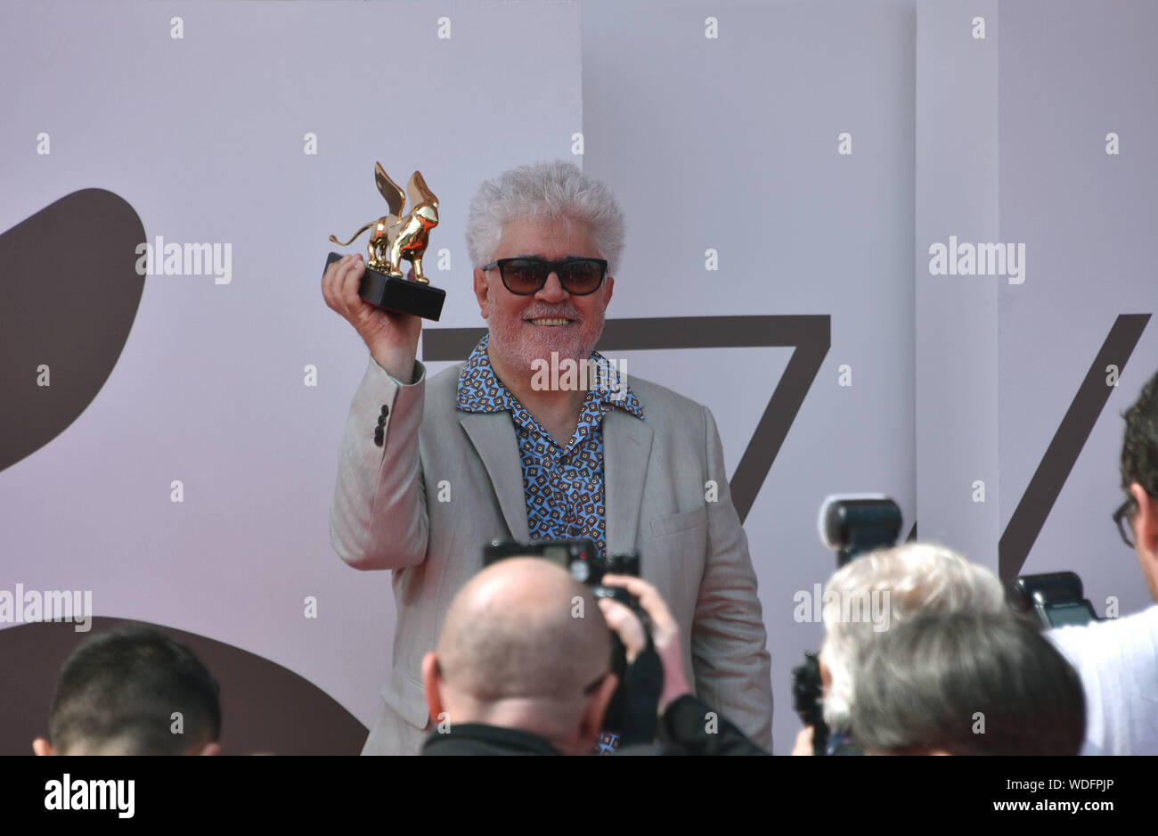 VENICE, Italy. 29th Aug, 2019. Pedro Almodovar shows the Golden Lion at Palazzo del Cinema after receiving it for lifetime achievements during the 76th Venice Film Festival on August 29, 2019 in Venice, Italy. Credit: Andrea Merola/Awakening/Alamy Live News Stock Photo