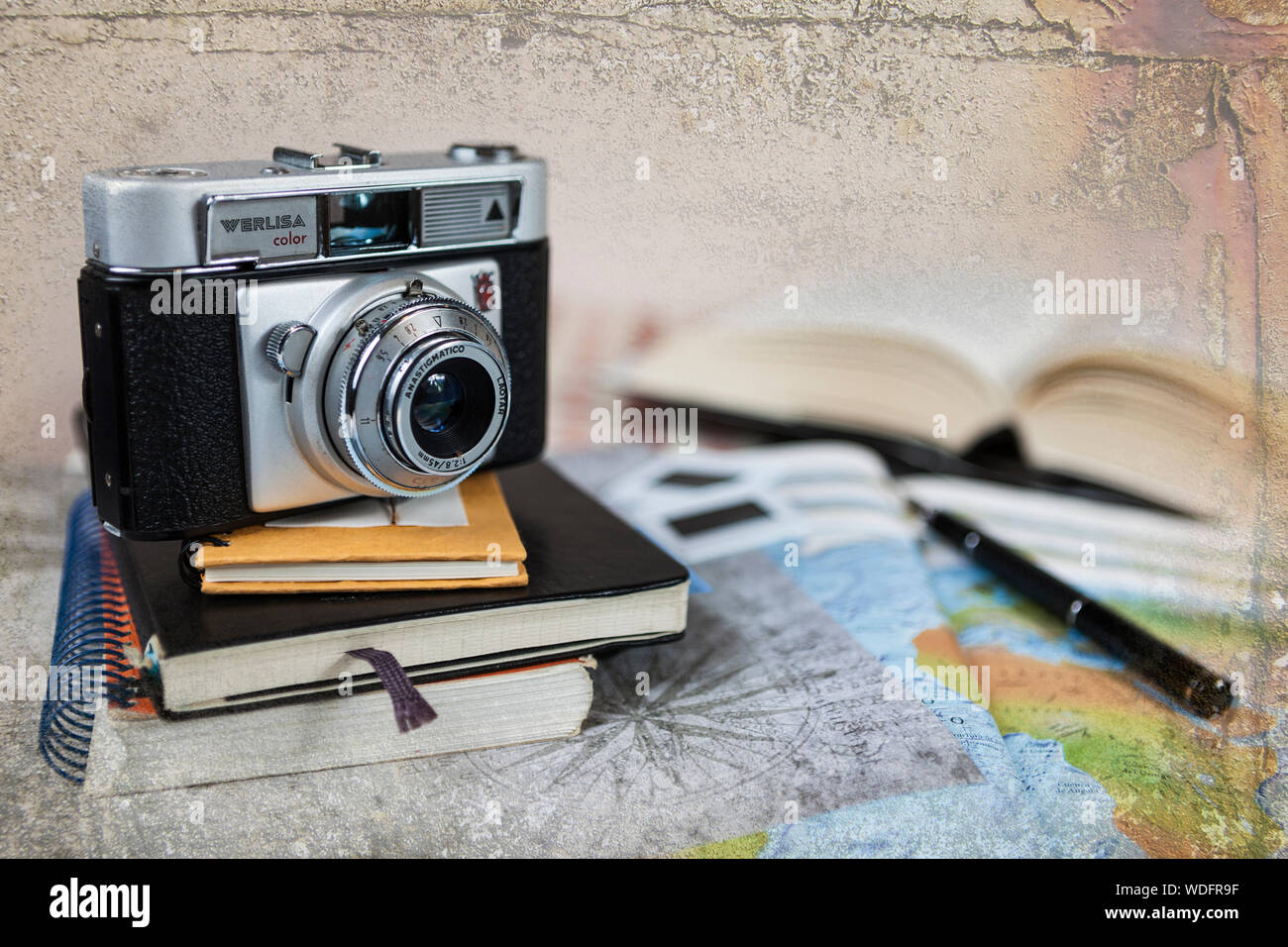 Travel photography: camera, books and maps Stock Photo