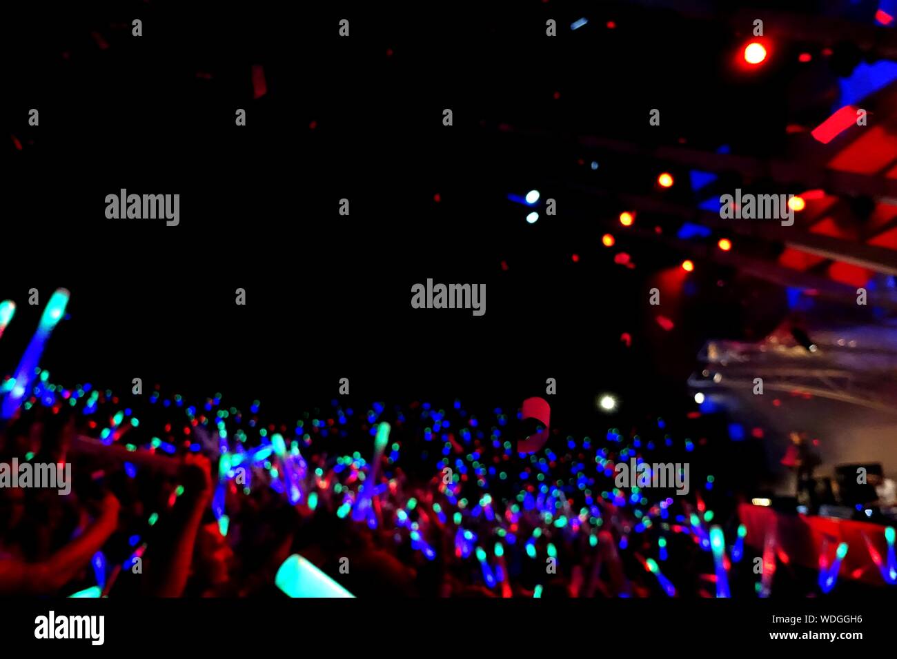 Illuminated Crowd At Popular Music Concert Stock Photo