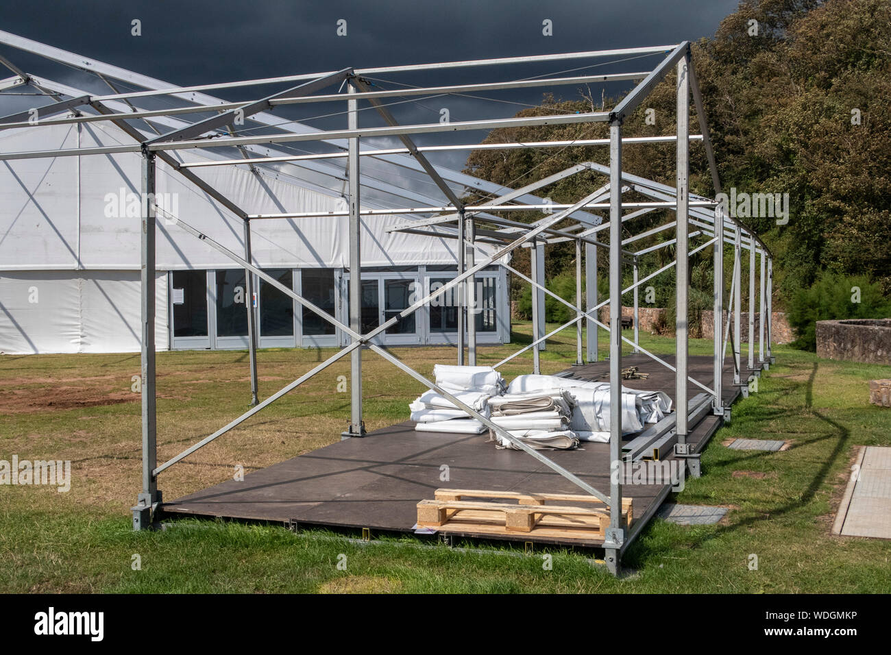 Constructing or dismantling a marquee after a festival, under partial construction. Stock Photo