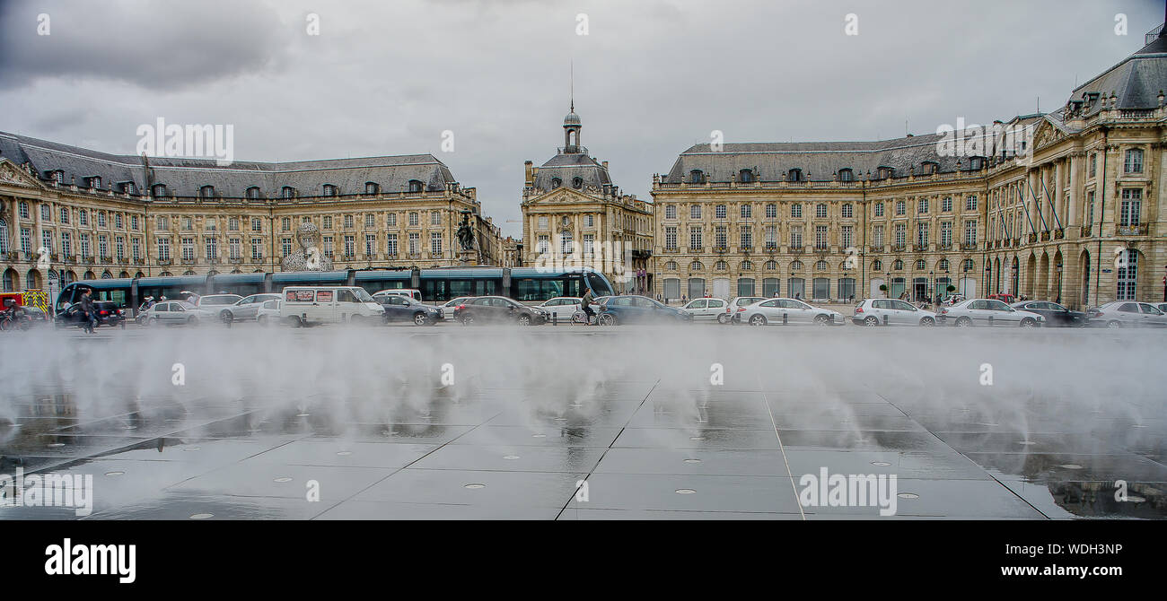 Neoclassical buildings in the water mirror of the Place de la Bourse de Bordeaux Stock Photo