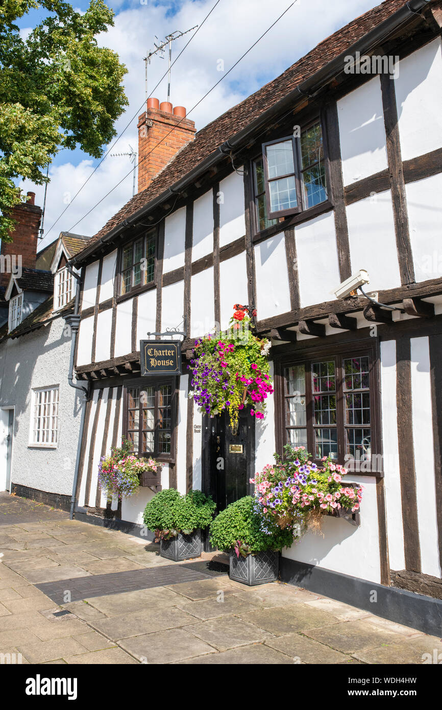 Tudor timber framed black and white medieval charter house. West Street, Warwick, Warwickshire, England Stock Photo