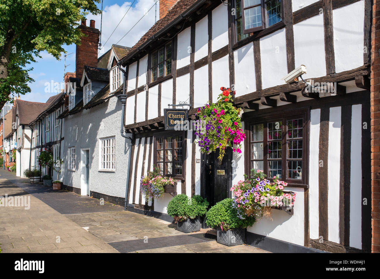 Tudor timber framed black and white medieval charter house. West Street, Warwick, Warwickshire, England Stock Photo