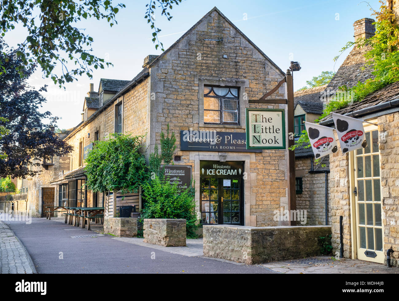 Green and pleasant tea rooms  in the early morning light. Bourton on the Water, Cotswolds, Gloucestershire, England Stock Photo