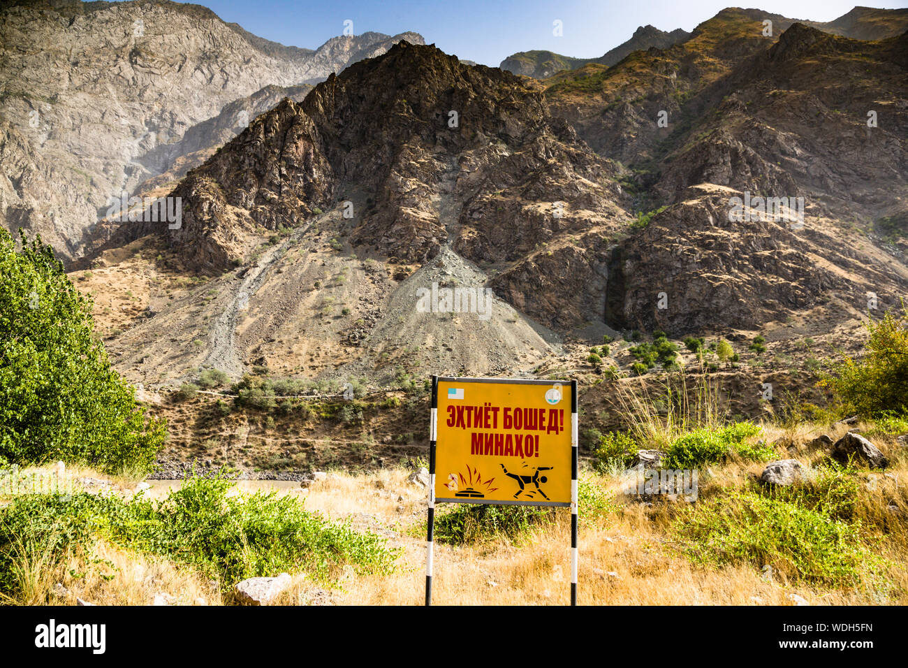 Dangerous landmines are still hidden in the border area with Afghanistan next to the Pamir Highway in Tajikistan. Landmine Area near Dashti-Jum Jamoat, Tajikistan (near Afghan border) Stock Photo