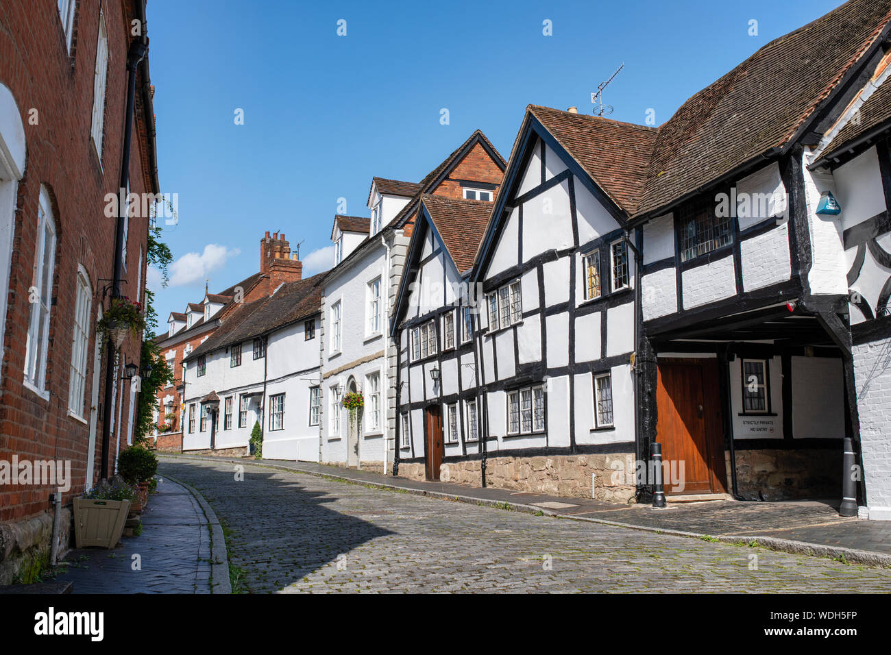 Tudor timber framed black and white medieval houses. Mill Street, Warwick, Warwickshire, England Stock Photo