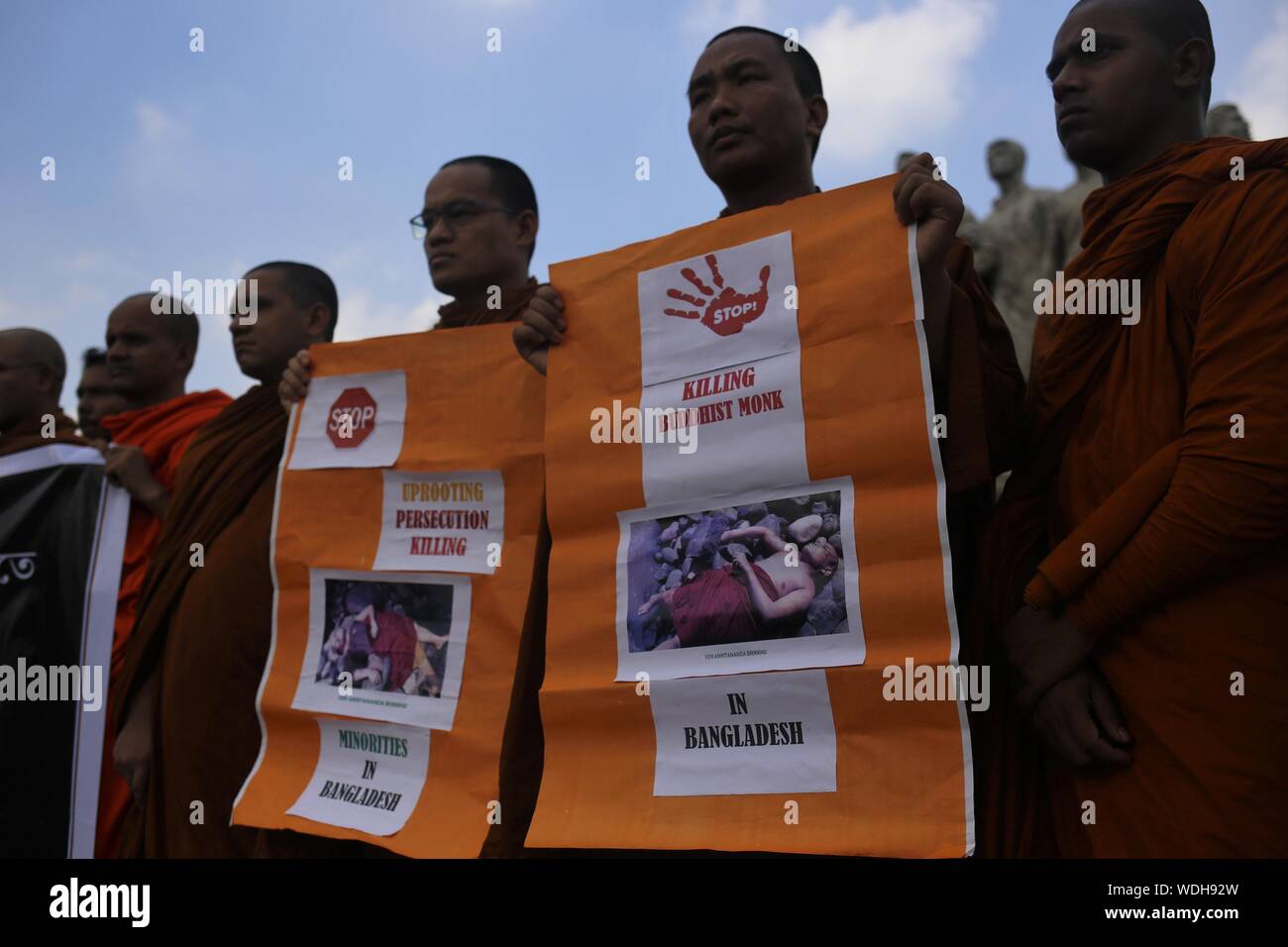 Dhaka, bangladesh. 29th Aug, 2019. Buddhist people protest against the recent killing of a monk and demand for murder trial at Anti-Terrorism Raju Memorial Sculpture near Dhaka University. Credit: MD Mehedi Hasan/ZUMA Wire/Alamy Live News Stock Photo