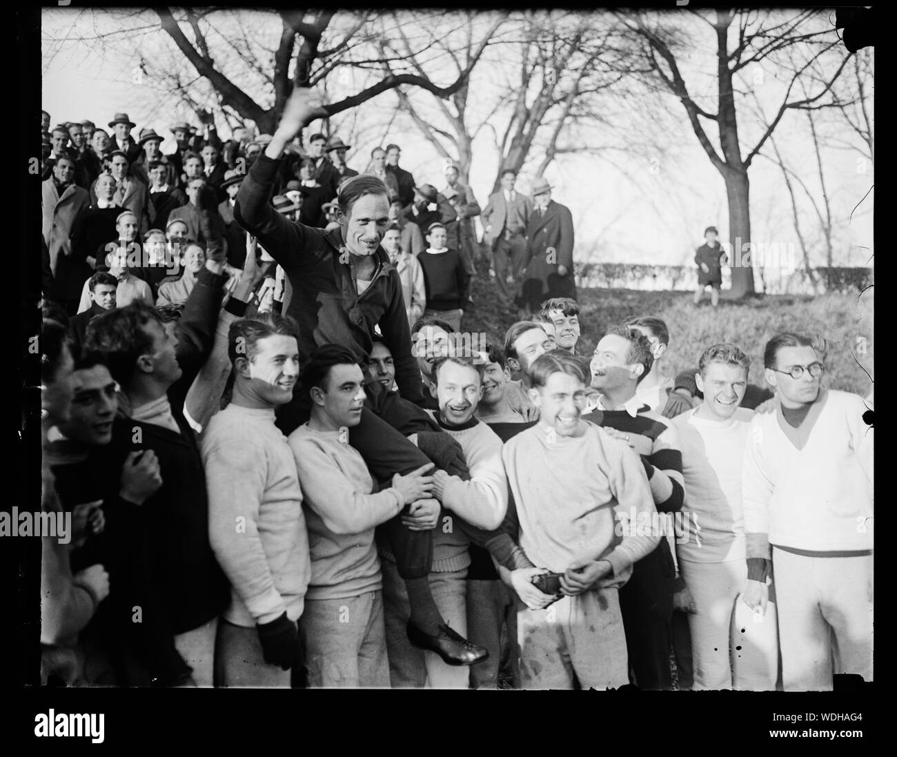 Georgetown University students give German track star a noisy welcome in Washington. Students at Georgetown University where he is a guest while in Washington gave Dr. Otto Peltzer, noted German athlete, a noisy welcome when he appeared at the athletic field for his first workout today since landing on American soil. Dr. Peltzer has beaten such stars as Paavo Nurmi and Edvin Wide in the 1,500 meters on the tracks in Europe Abstract/medium: 1 negative : glass  4 x 5 in. or smaller Stock Photo