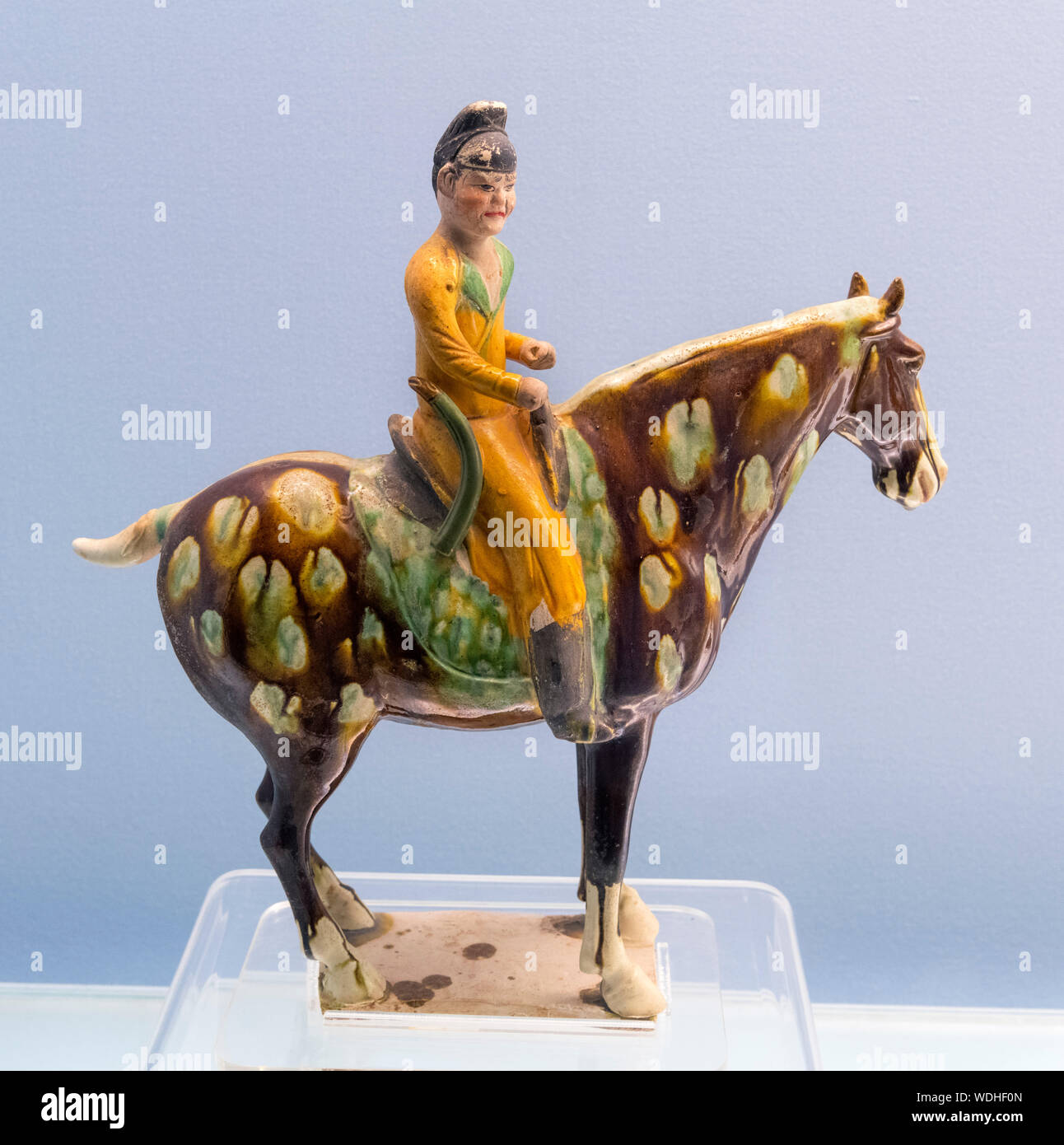 Polychrome glazed pottery Equestrian figurine, Tang Dynasty (619-907 AD) Stock Photo