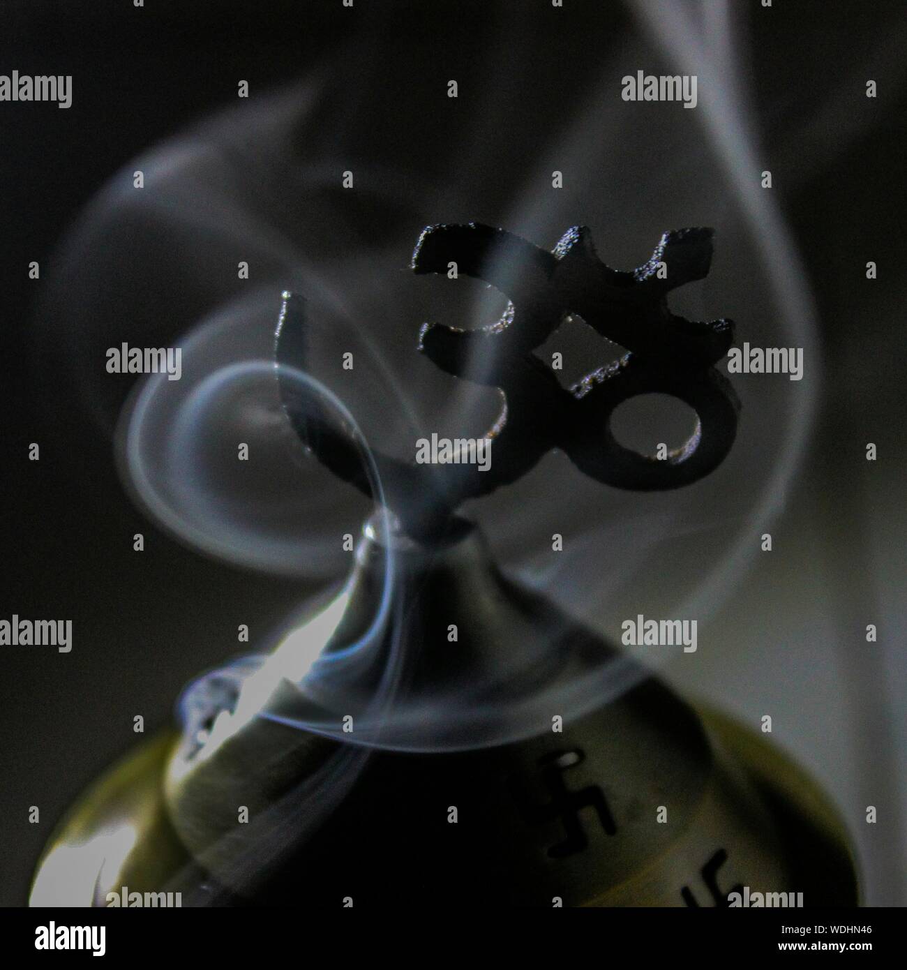 Close-up Of Smoke Around Om Symbol Stock Photo