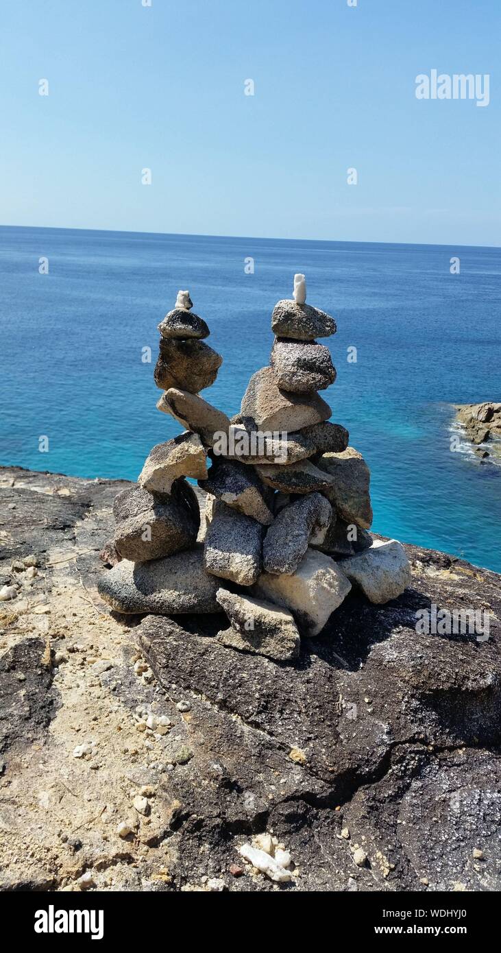 Stacks Of Stones Against Sea Stock Photo
