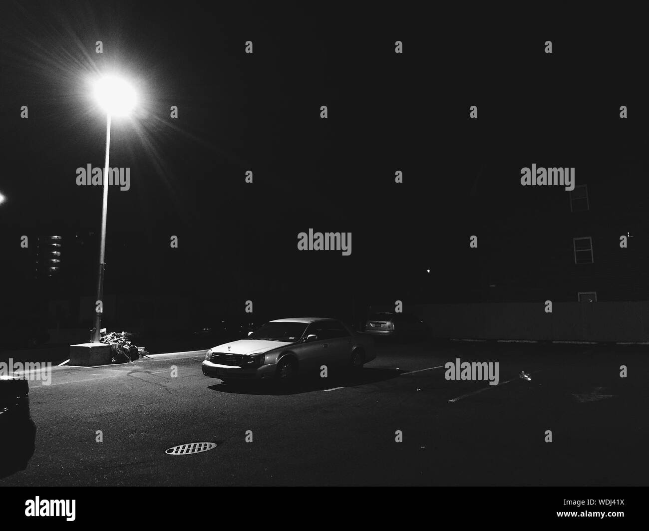 Car night parked street hi-res stock photography and images - Alamy