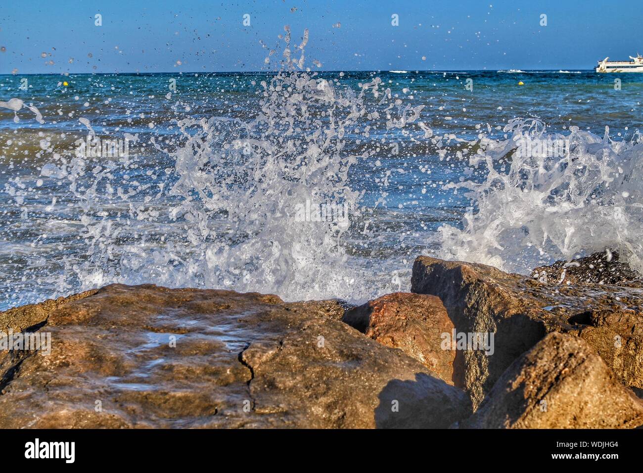 Waves Breaking On Shore Stock Photo