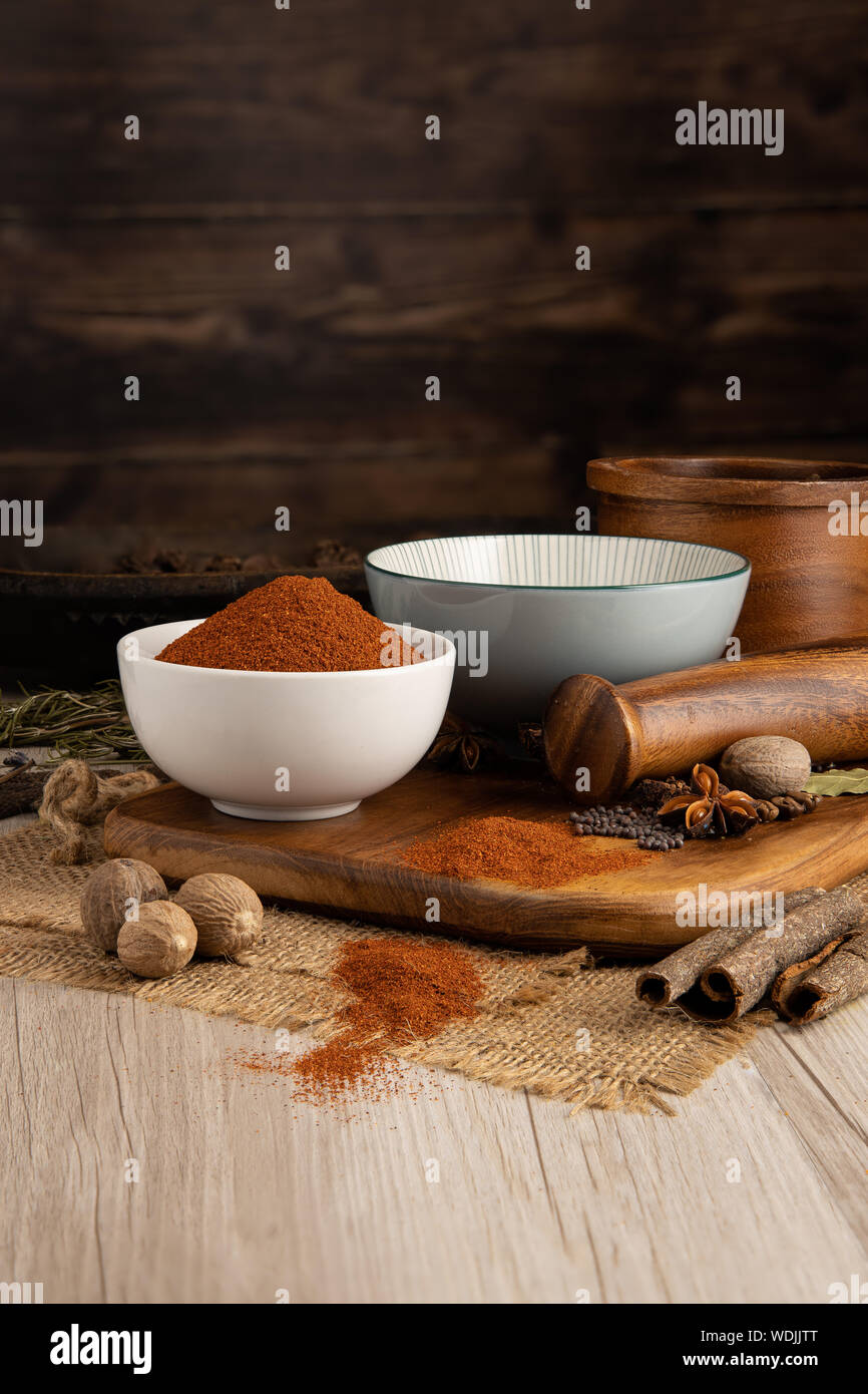 Tex Mex Chilli Chile Powder in a bowl and food preparation and kitchen set Stock Photo
