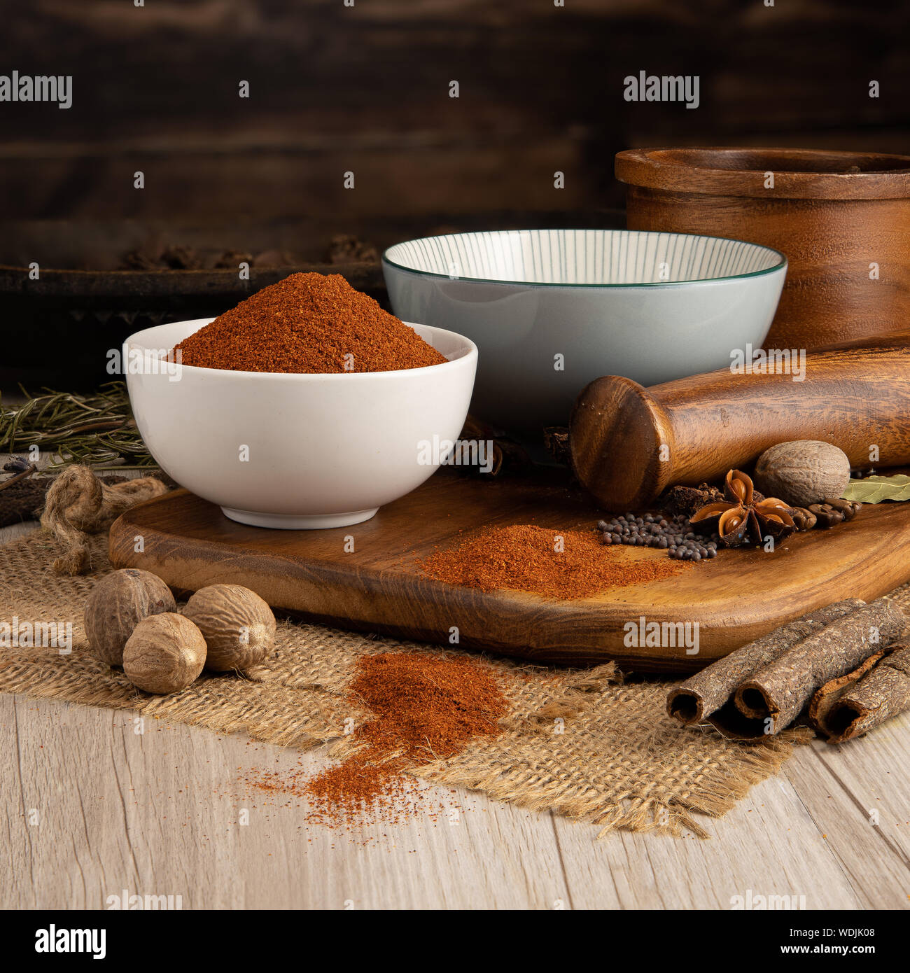 Tex Mex Chilli Chile Powder in a bowl and food preparation and kitchen set Stock Photo