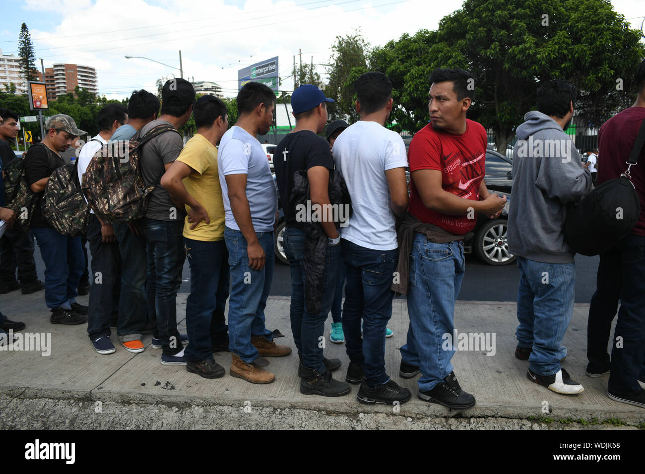 Guatemala City, Guatemala. 2nd Aug, 2019. Guatemalan asylum seekers deported from the US wait for relatives as they arrived at Guatemala City International Airport Friday, still wearing the bracelets given to them at a detention center in Arizona. Guatemala recently signed a 'safe third country' agreement with the Trump administration, which allows the US to send asylum seekers to Guatemala, deemed 'safe' under the deal. Credit: Miguel Juarez Lugo/ZUMA Wire/Alamy Live News Stock Photo