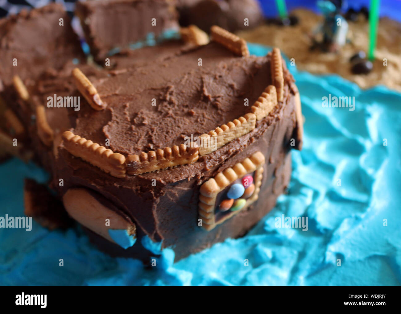 Chocolate cake with mascarpone on rustic background. Stock Photo