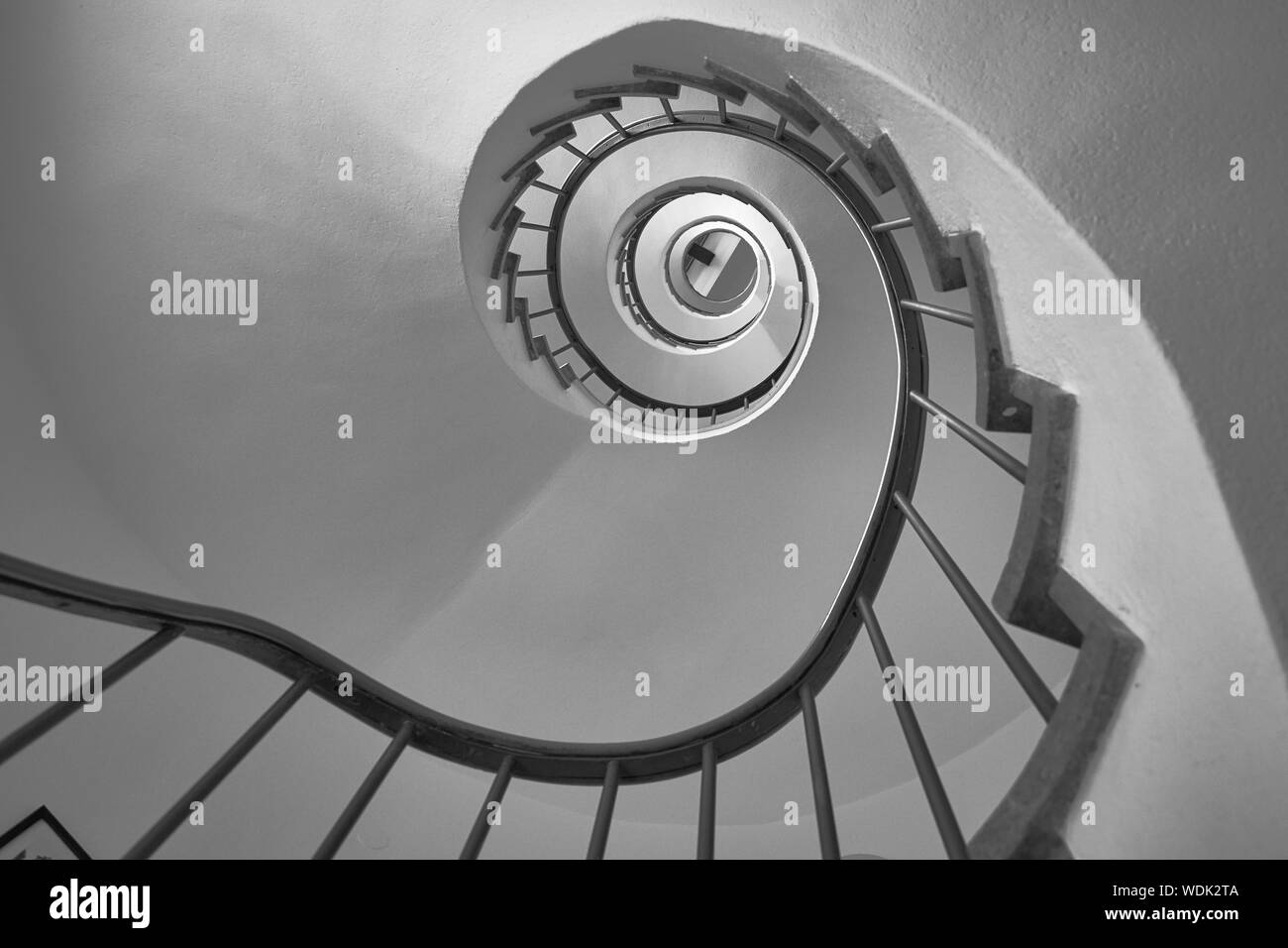 Spiral staircase in black and white from below Stock Photo
