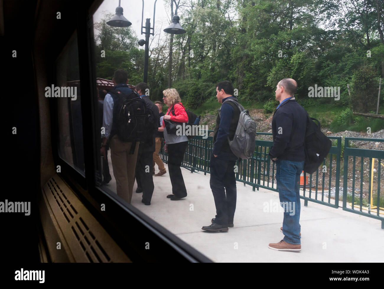 Passengers waiting in line to board Amtrak train to Philadelphia PA Stock Photo