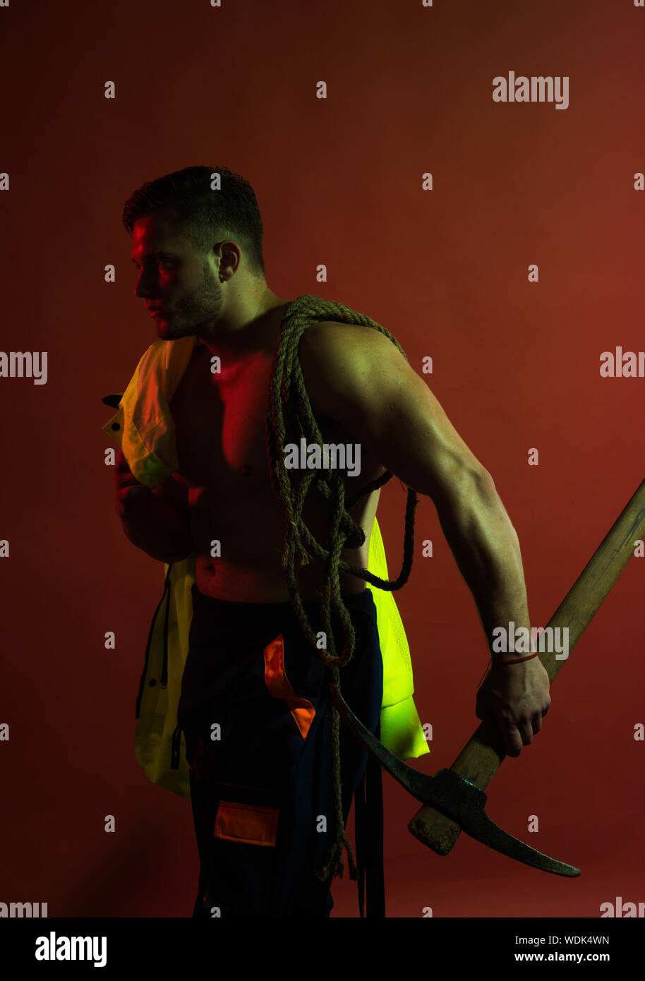 Being under construction. Hard worker with muscular torso. Construction ...